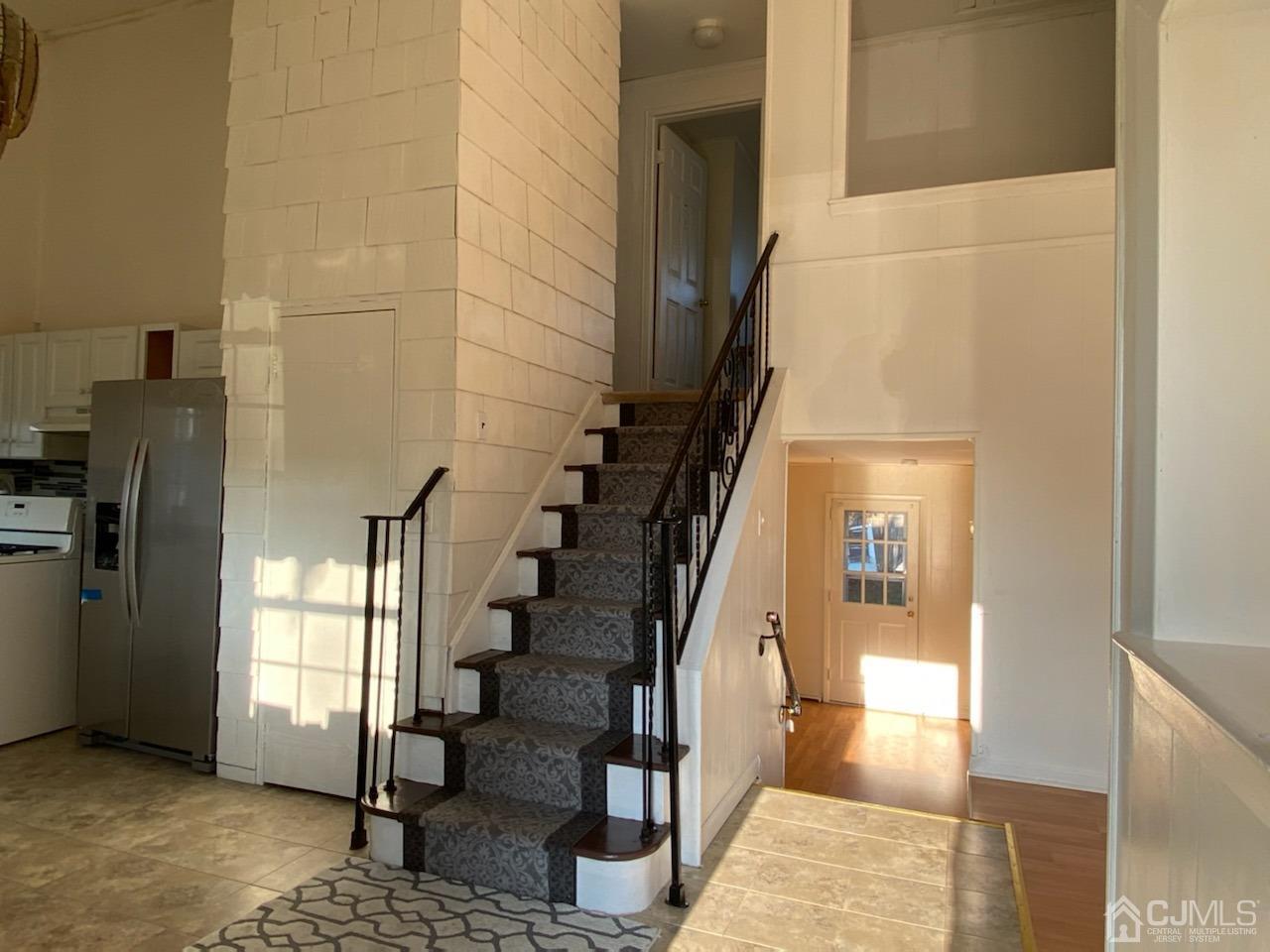 27 Eardley Road Edison, NJ 08817 - Photo 4 of 14 a view of entryway and hall with wooden floor