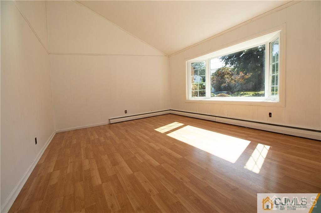 27 Eardley Road Edison, NJ 08817 - Photo 5 of 14 a view of an empty room and window