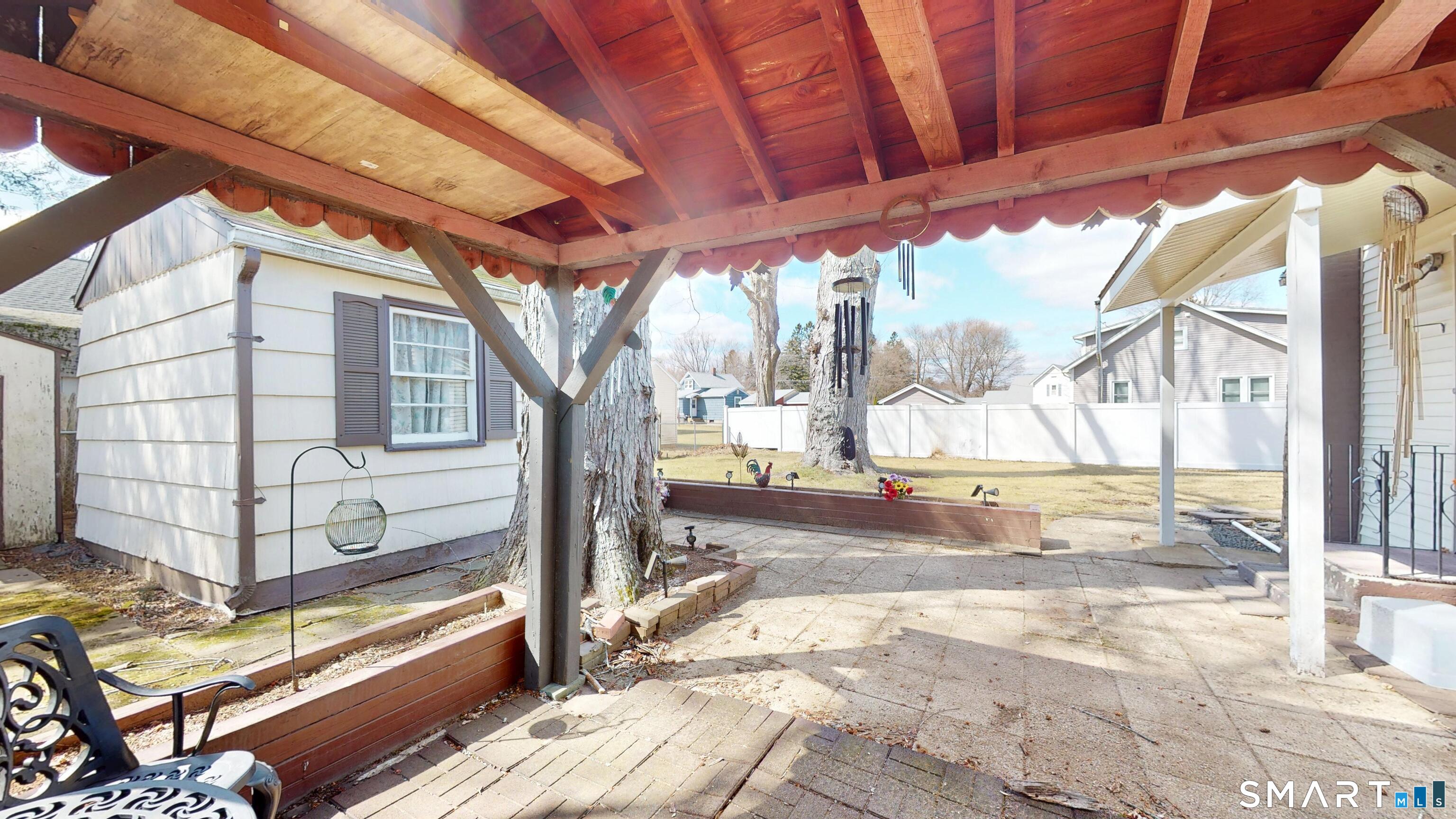 137 Brook Street Bristol, CT 06010 - Photo 11 of 37 a view of a backyard with a large tree