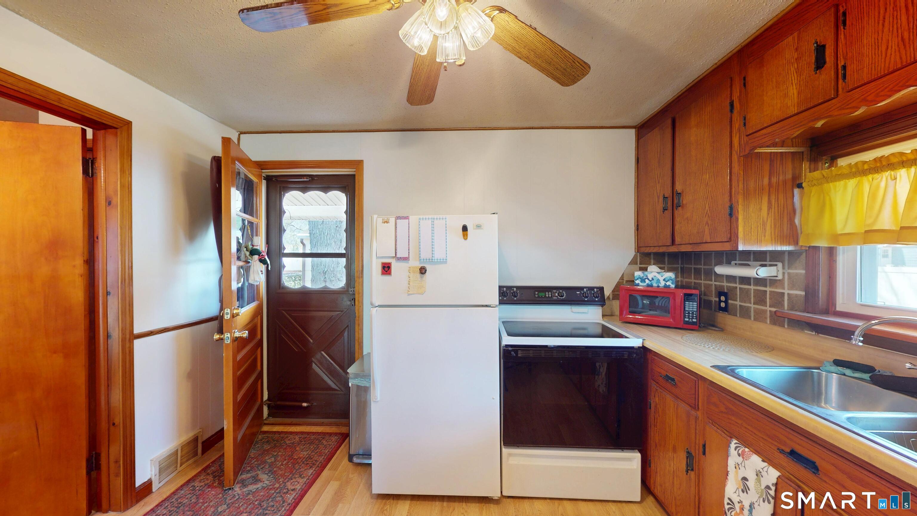 137 Brook Street Bristol, CT 06010 - Photo 19 of 37 a kitchen with stainless steel appliances granite countertop a refrigerator a stove and a sink
