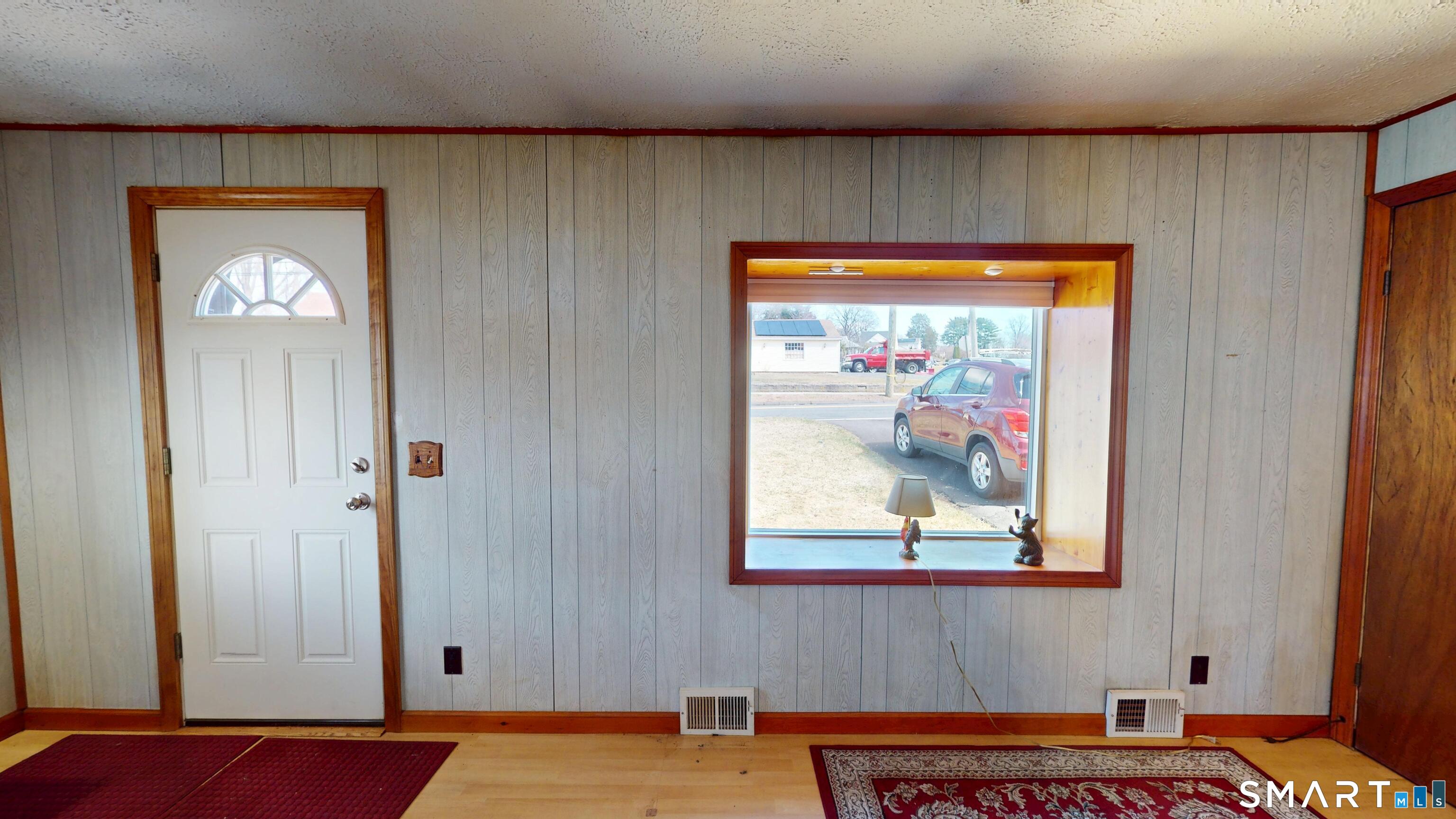 137 Brook Street Bristol, CT 06010 - Photo 24 of 37 a view of a hallway with wooden floor and a cabinet