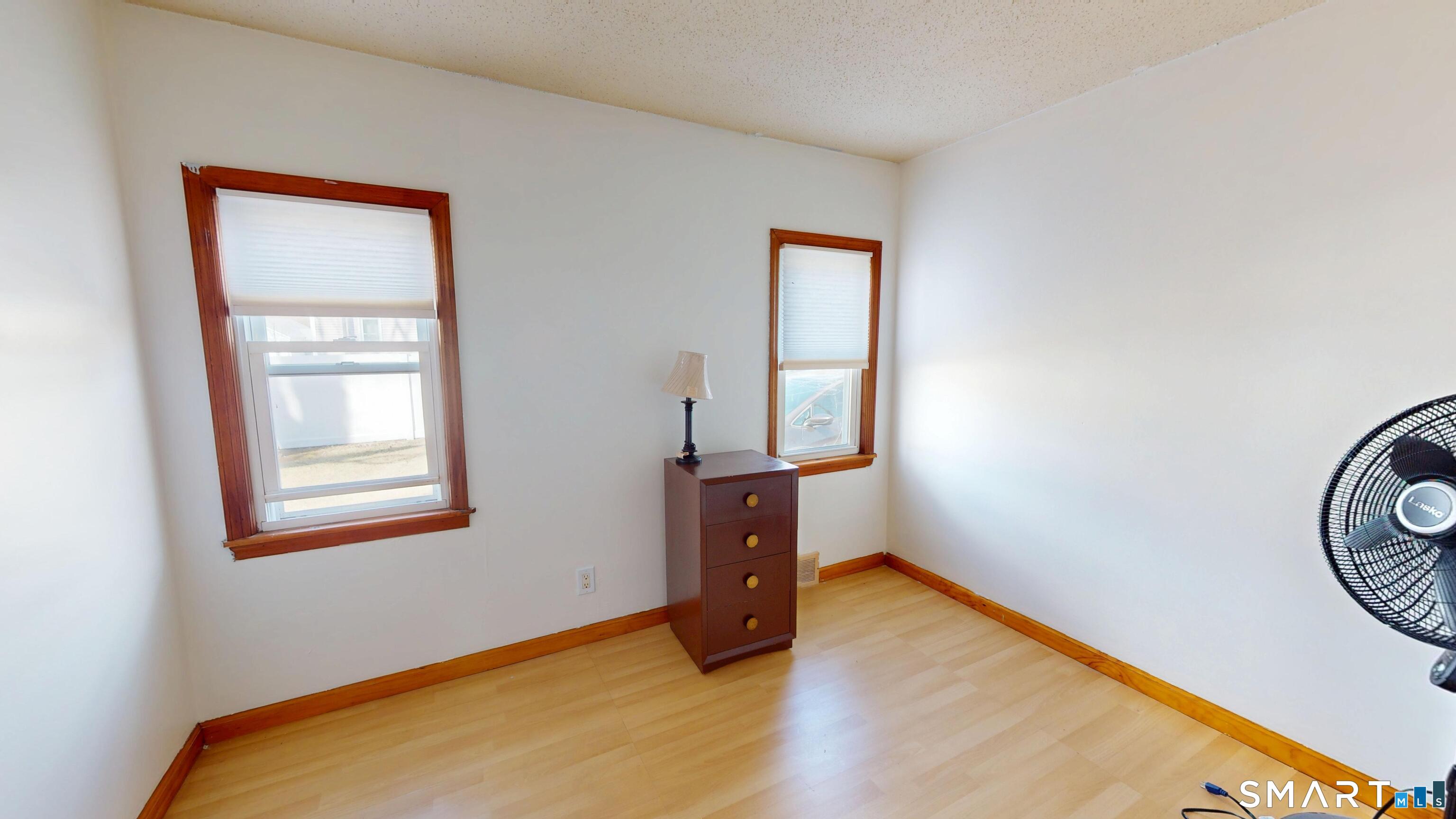 137 Brook Street Bristol, CT 06010 - Photo 29 of 37 a room with window and a wooden floor