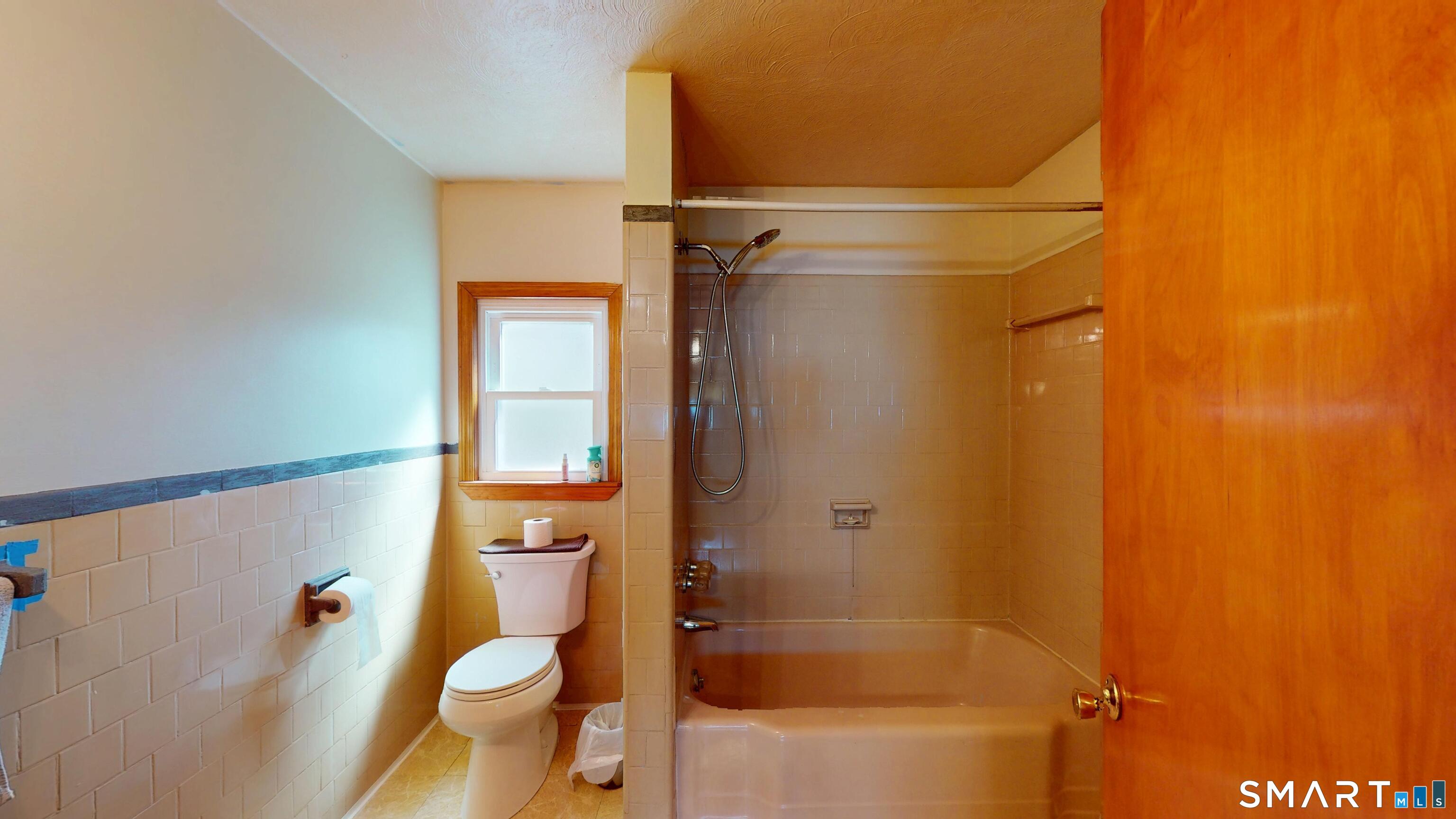 137 Brook Street Bristol, CT 06010 - Photo 34 of 37 a bathroom with a granite countertop toilet and a shower