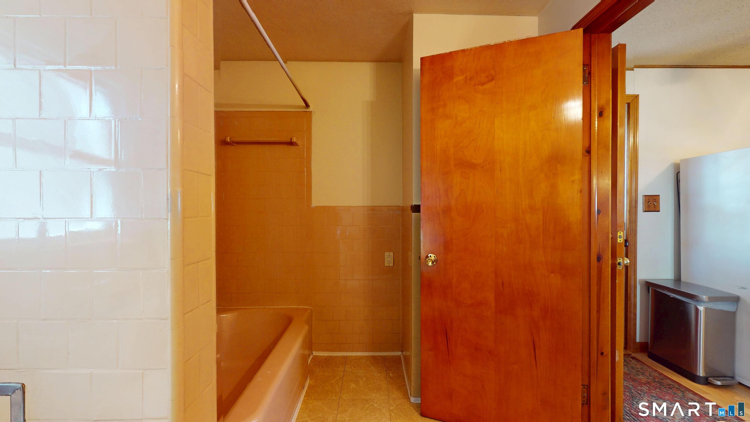 137 Brook Street Bristol, CT 06010 - Photo 35 of 37 a bathroom with a shower and a glass door