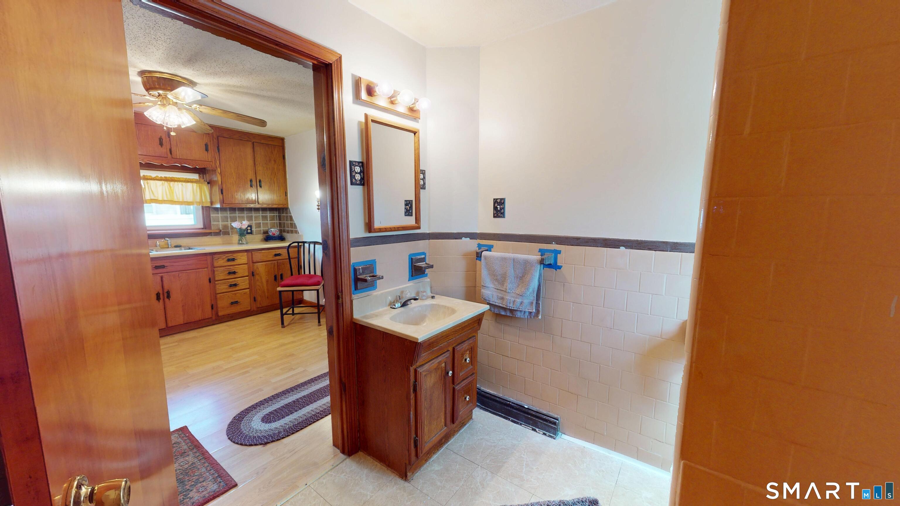 137 Brook Street Bristol, CT 06010 - Photo 36 of 37 a en suite bathroom with a sink and mirror