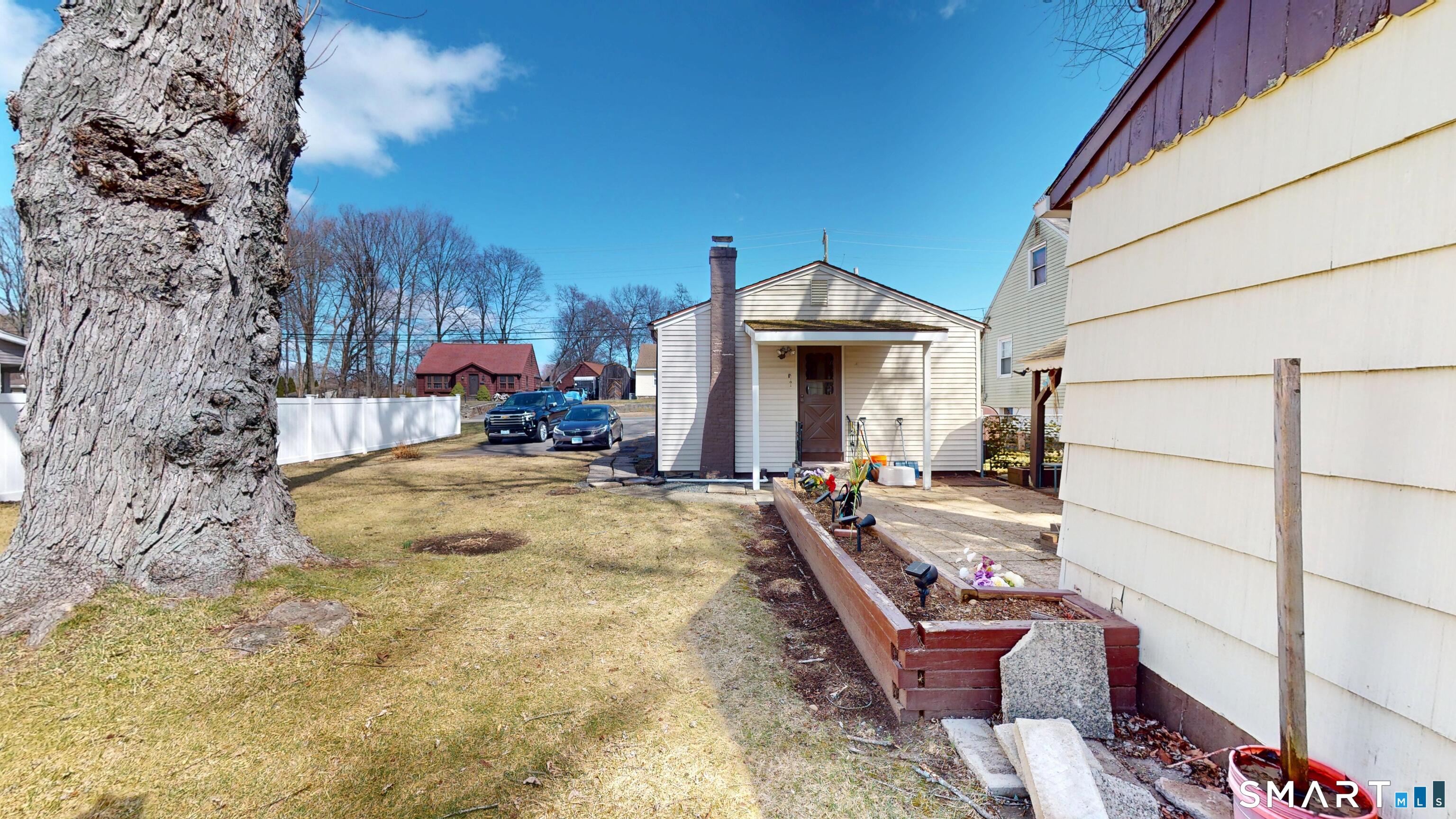 137 Brook Street Bristol, CT 06010 - Photo 6 of 37 a view of a patio with a yard
