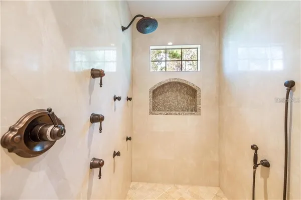 a bathroom with a sink a washer and dryer next to it