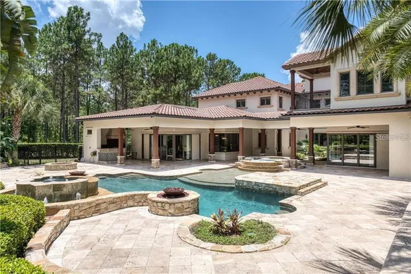 a view of a swimming pool with a patio
