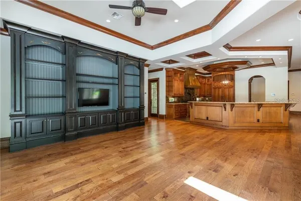 a view of a kitchen with stainless steel appliances granite countertop a stove a sink and a refrigerator
