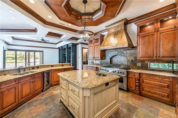 a kitchen with stainless steel appliances granite countertop a sink and cabinets