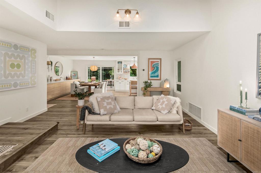 1427 Avocado Road Oceanside, CA 92054 - Photo 11 of 60 a living room with furniture and a wooden floor