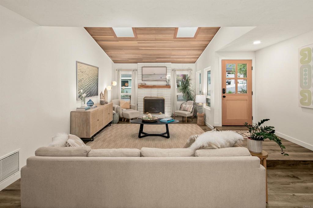 1427 Avocado Road Oceanside, CA 92054 - Photo 12 of 60 a living room with furniture and a fireplace