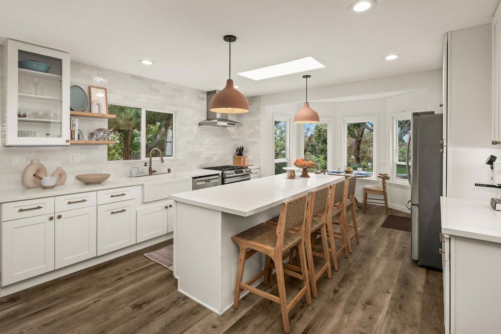 1427 Avocado Road Oceanside, CA 92054 - Photo 19 of 60 a kitchen with a sink a counter space appliances and cabinets