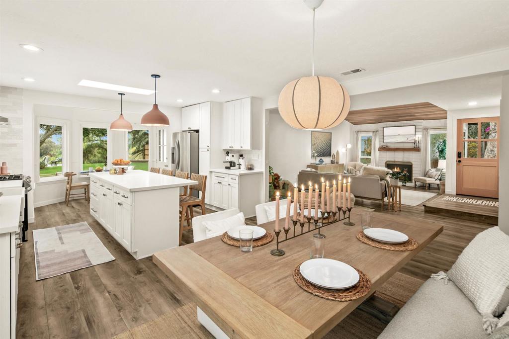 1427 Avocado Road Oceanside, CA 92054 - Photo 21 of 60 a open dining room with furniture and a chandelier
