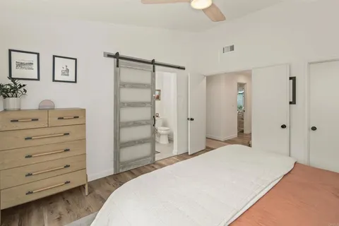 a bathroom with a tub sink and a mirror
