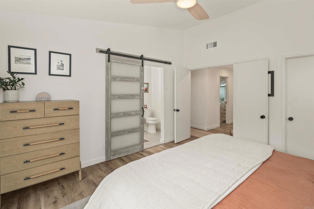 1427 Avocado Road Oceanside, CA 92054 - Photo 24 of 60 a bedroom with a bed and a dresser