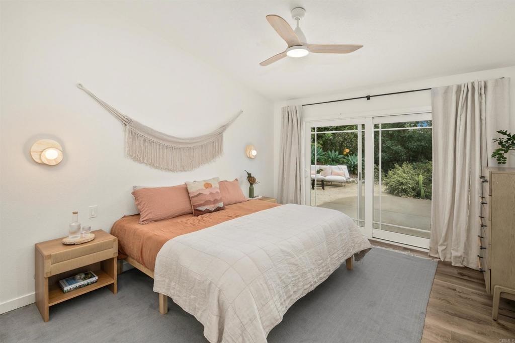 1427 Avocado Road Oceanside, CA 92054 - Photo 25 of 60 a bedroom with a bed and a window
