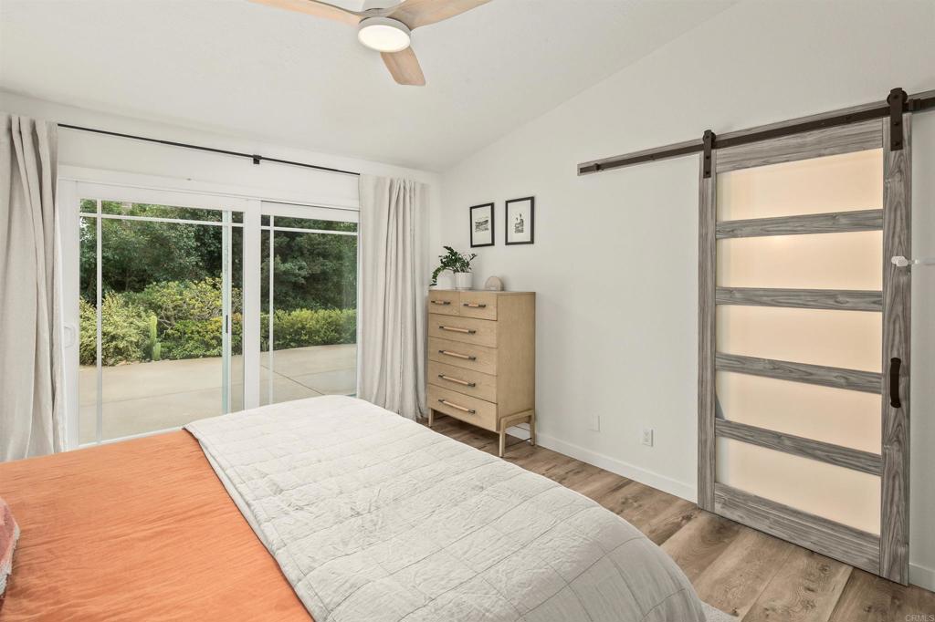 1427 Avocado Road Oceanside, CA 92054 - Photo 27 of 60 a bedroom with a bed and a window