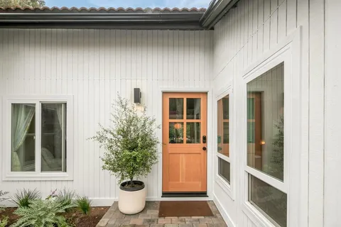 a view of a house with a yard and garage