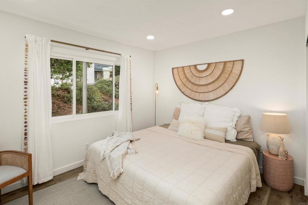 1427 Avocado Road Oceanside, CA 92054 - Photo 32 of 60 a bedroom with bed and a window