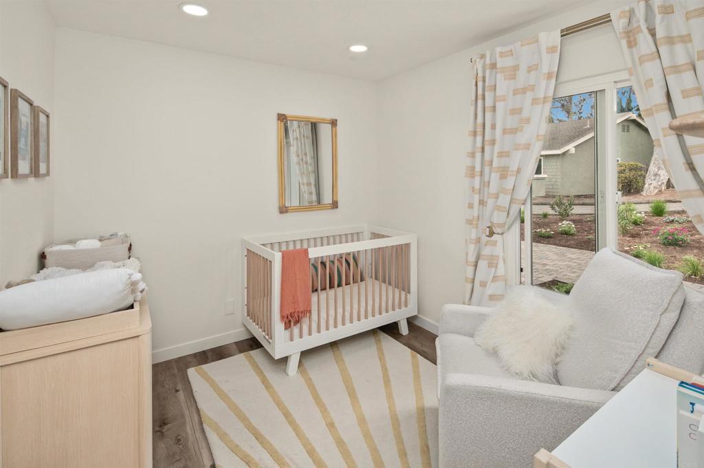 1427 Avocado Road Oceanside, CA 92054 - Photo 34 of 60 a bedroom with furniture and a wooden floor
