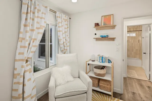 a backyard of a house with a table and chairs