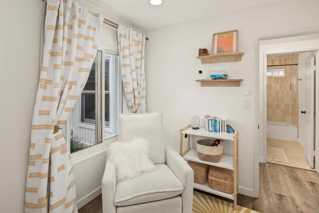 1427 Avocado Road Oceanside, CA 92054 - Photo 35 of 60 a living room with furniture and a floor to ceiling window