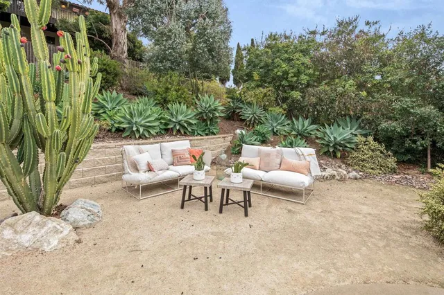 a view of a house with backyard and porch