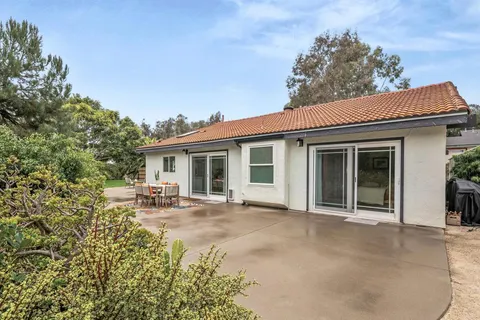 a view of a yard and patio