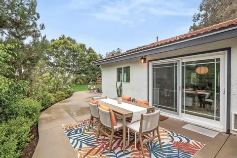 a view of an outdoor space with lounge chair