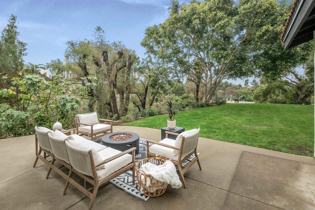 1427 Avocado Road Oceanside, CA 92054 - Photo 46 of 60 a view of a patio with couches and a table and chairs with garden view
