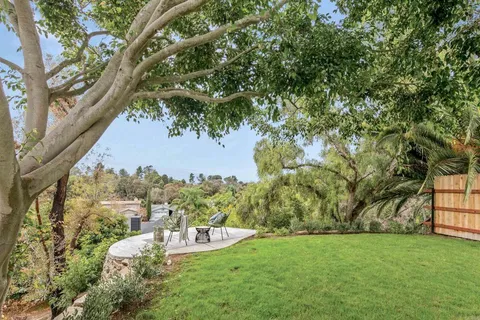 an aerial view of house with yard