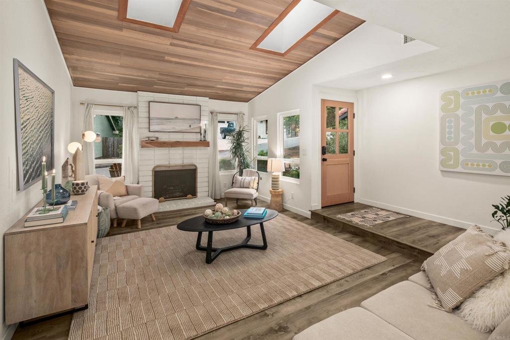 1427 Avocado Road Oceanside, CA 92054 - Photo 10 of 60 a living room with furniture and a fireplace