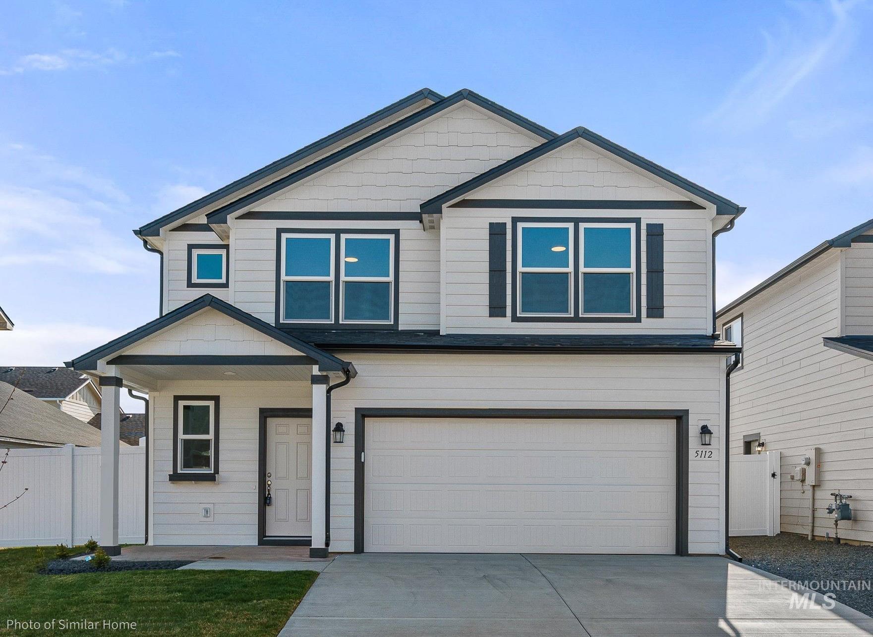 877 West Roan Ridge Nampa, ID 83686 - Photo 1 of 13 Craftsman inspired home with driveway and an attached garage