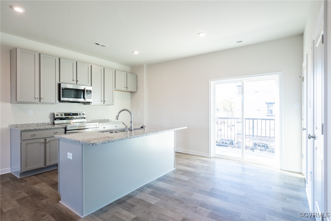 4182 Park Trail Drive, Unit U2 Richmond, VA 23223 - Photo 1 of 28 a view of a kitchen with a sink a stove and cabinets