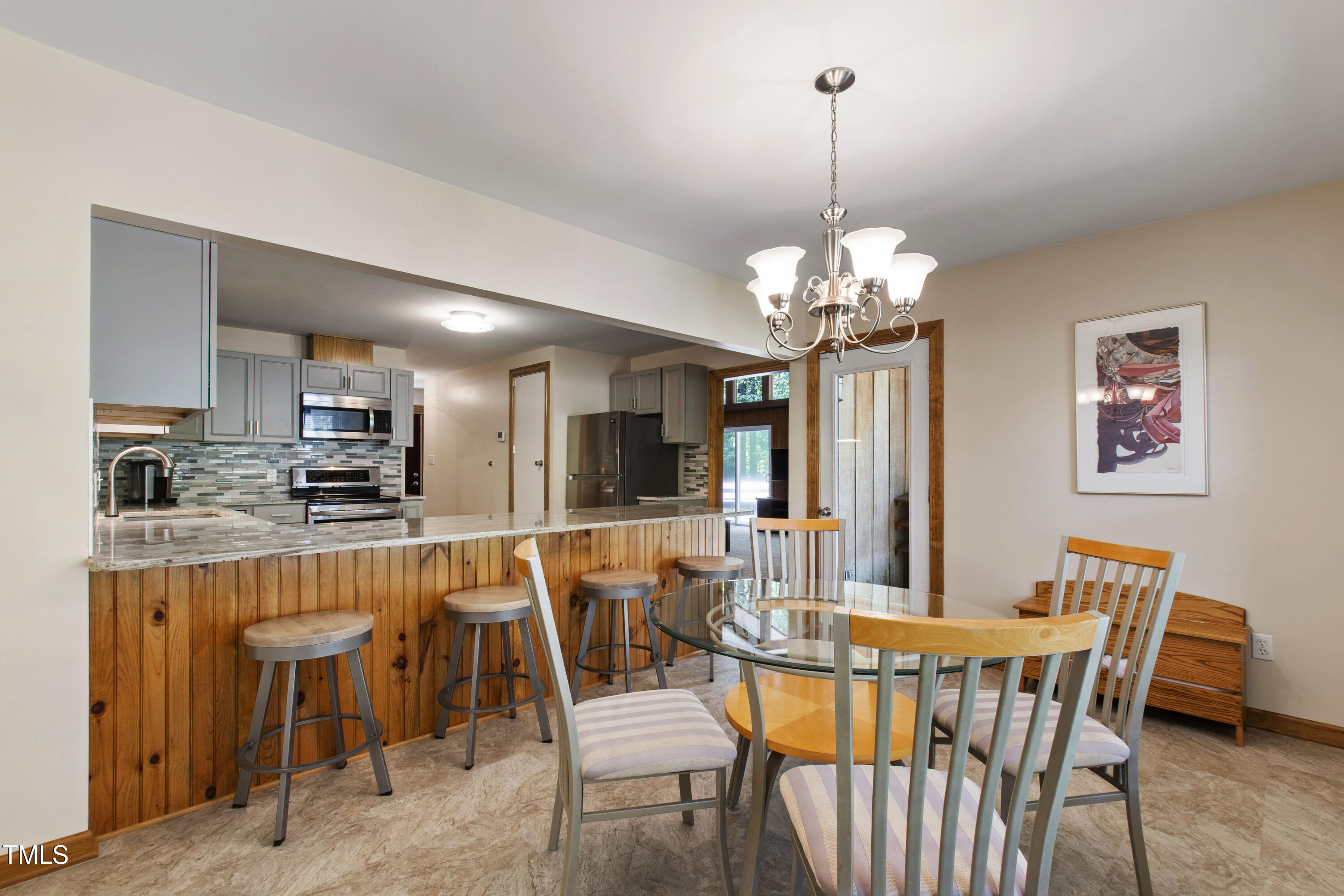 5415 Bradshaw Quarry Road Efland, NC 27243 - Photo 16 of 65 a dining room with furniture a chandelier and window