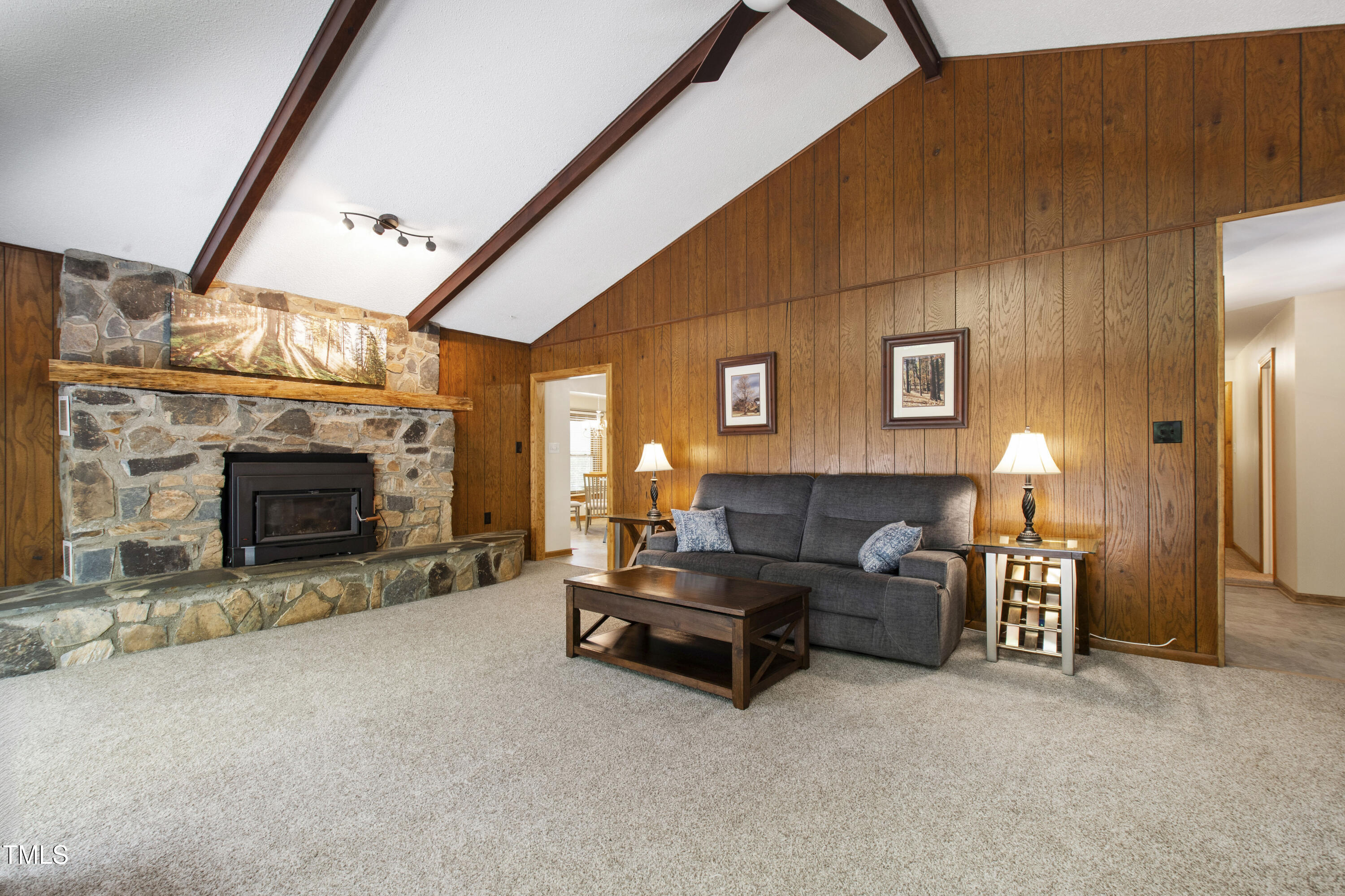 5415 Bradshaw Quarry Road Efland, NC 27243 - Photo 19 of 65 a living room with furniture and a fireplace