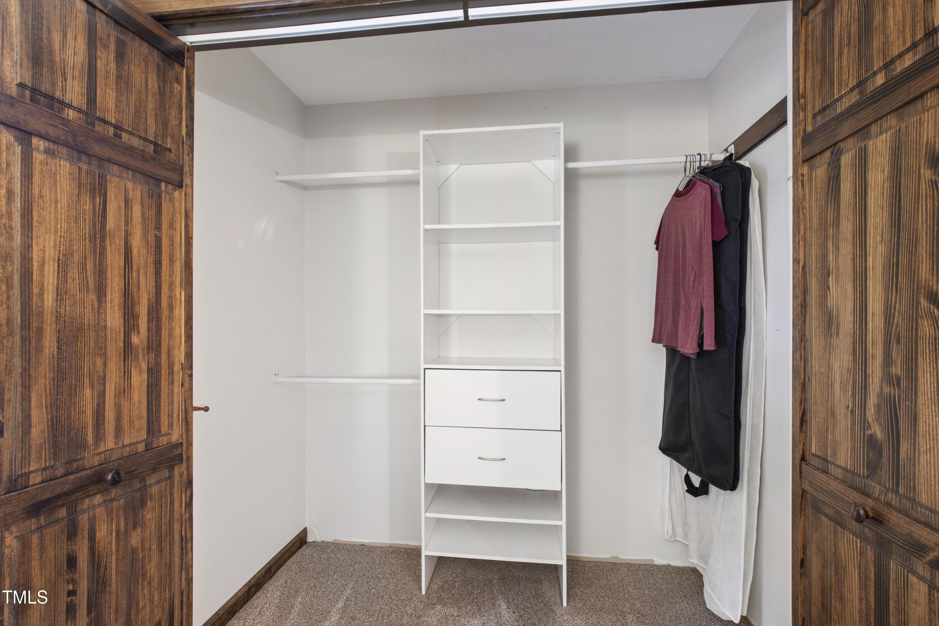 5415 Bradshaw Quarry Road Efland, NC 27243 - Photo 26 of 65 a view of walk in closet with clothes and shoes