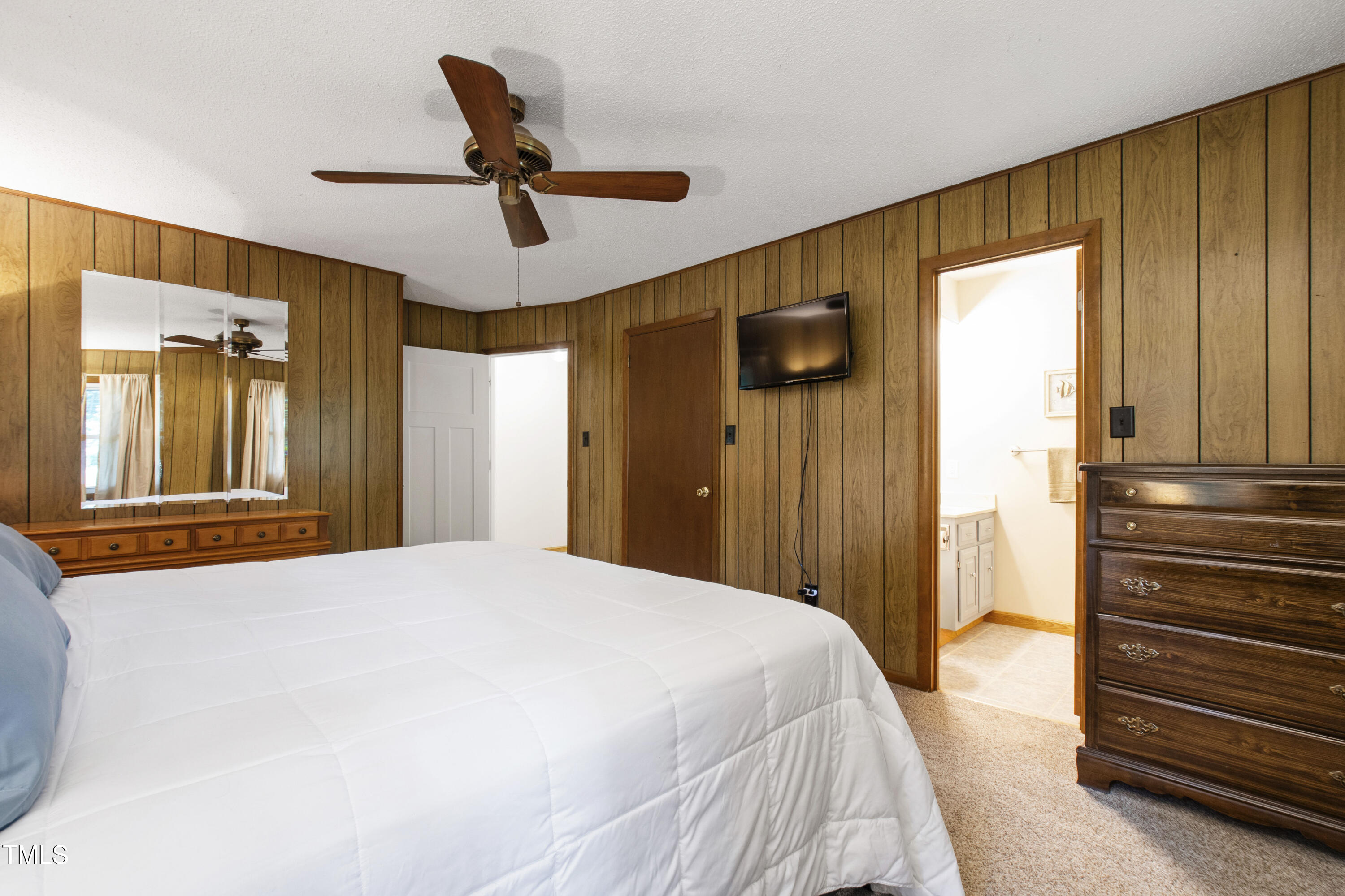 5415 Bradshaw Quarry Road Efland, NC 27243 - Photo 29 of 65 a bedroom with a bed and a window