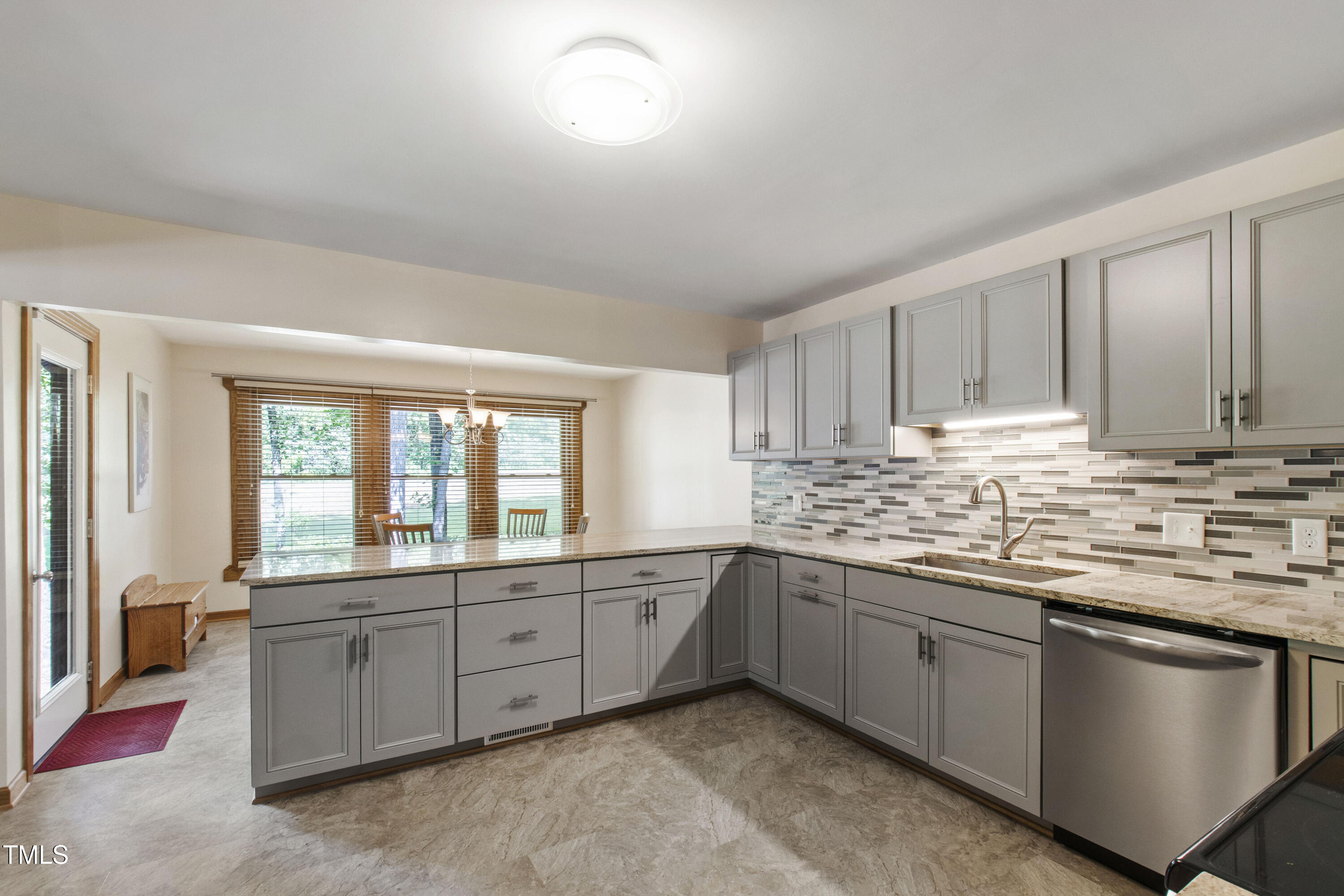5415 Bradshaw Quarry Road Efland, NC 27243 - Photo 3 of 65 a kitchen with stainless steel appliances granite countertop a stove and a sink