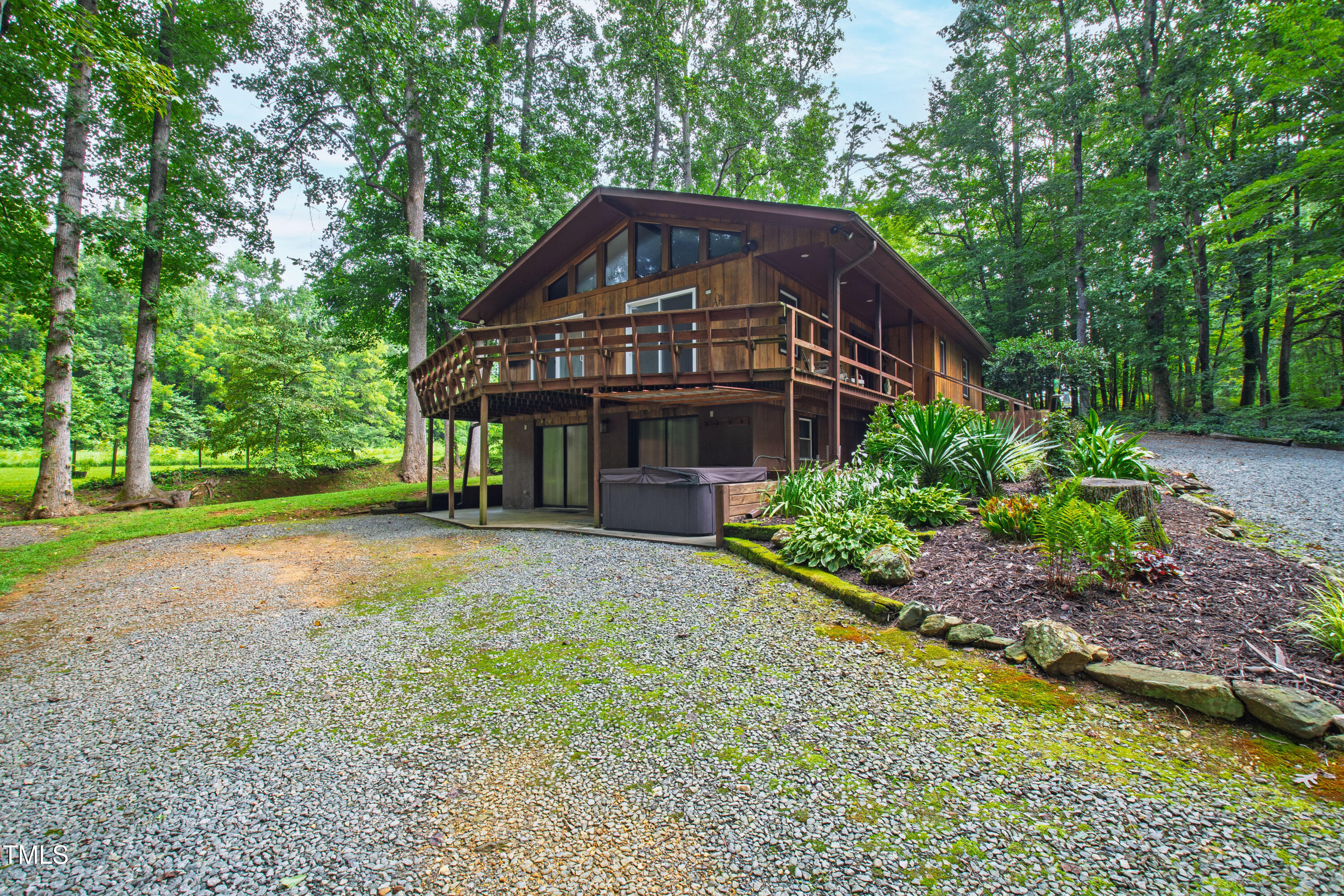 5415 Bradshaw Quarry Road Efland, NC 27243 - Photo 50 of 65 a view of a house with a yard