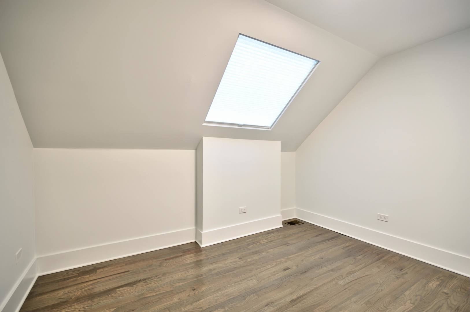 1917 South Racine Avenue, Unit 2F Chicago, IL 60608 - Photo 11 of 13 an empty room with wooden floor and windows