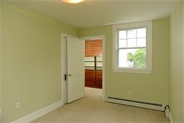 71 Fordham Road, Unit 71 Newton, MA 02465 - Photo 5 of 15 an empty room with a window