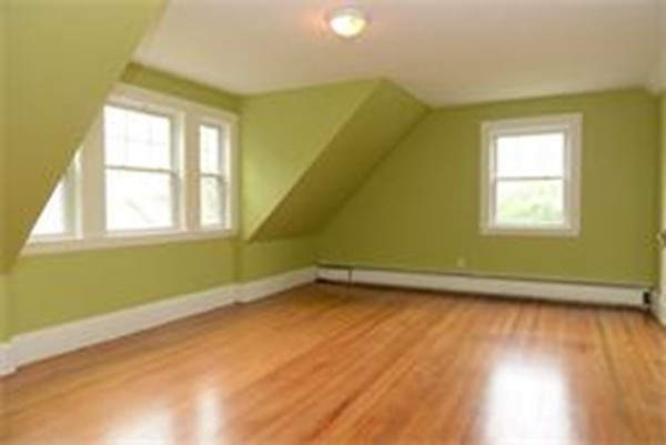 71 Fordham Road, Unit 71 Newton, MA 02465 - Photo 9 of 15 a view of a room with wooden floor and a window