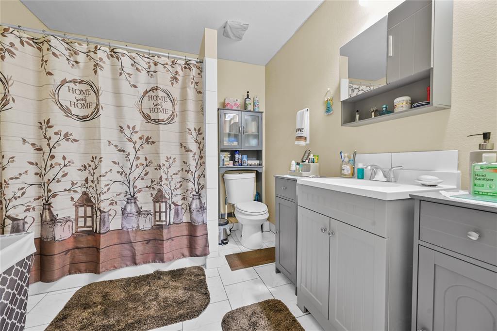 447 Masthead Road Gun Barrel City, TX 75156 - Photo 10 of 27 a bathroom with a sink toilet and shower