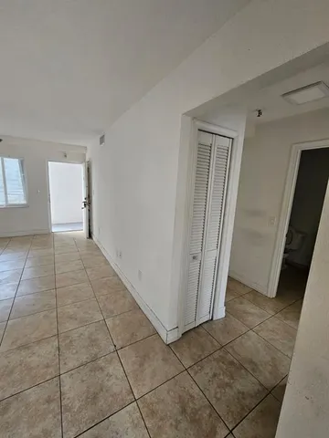 a view of a livingroom with an empty space and a sink