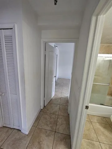 a view of a bathroom from a hallway