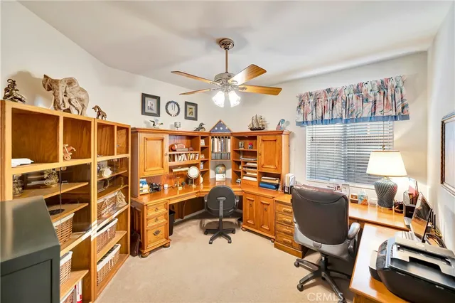 a bathroom with a granite countertop bathtub shower and toilet
