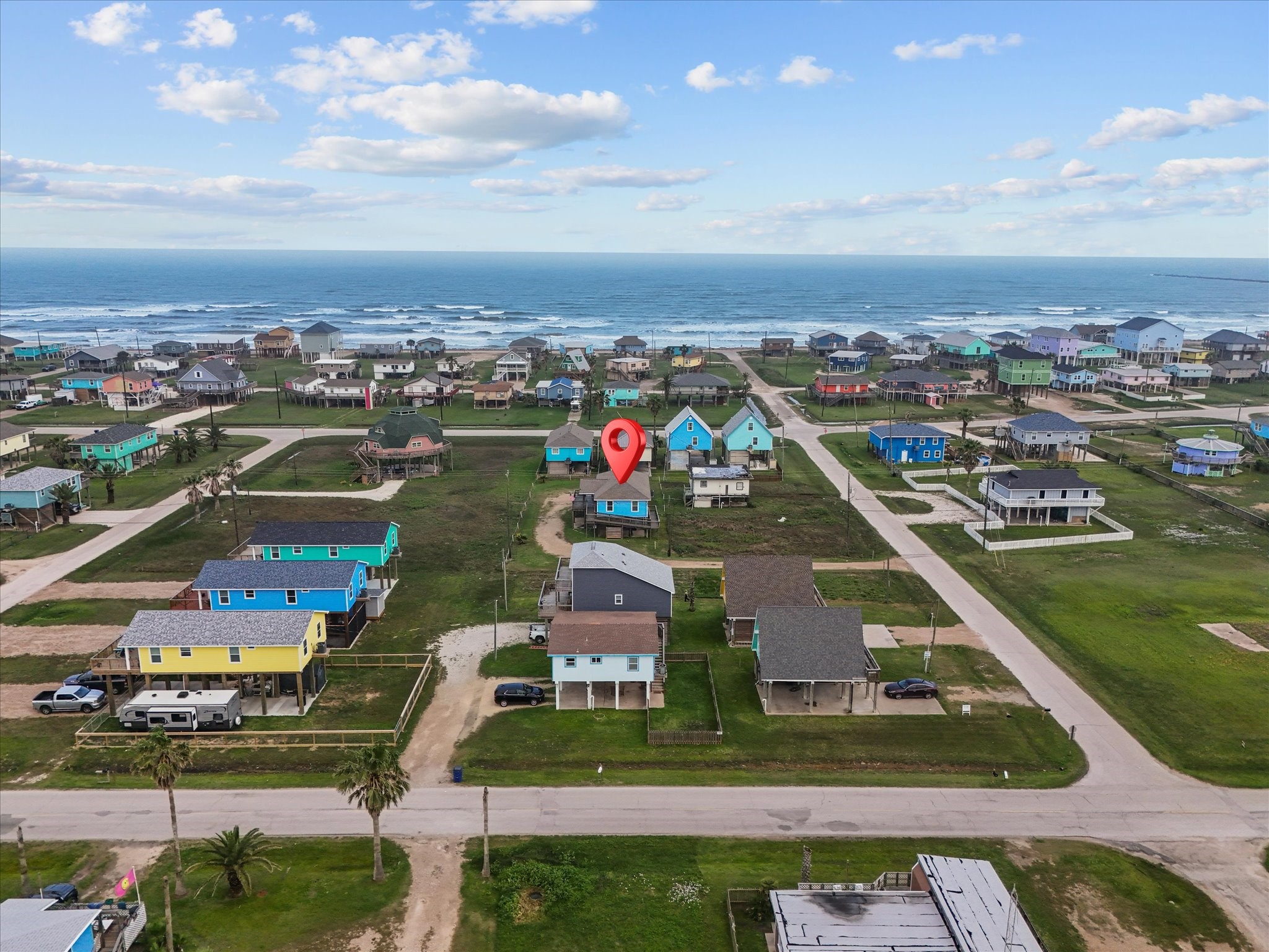 818 Surf Drive Surfside Beach, TX 77541 - Photo 6 of 29 Coastal neighborhood with colorful homes, located near the ocean. Ideal for beach lovers, the area offers a relaxed, scenic environment with easy access to the shoreline.