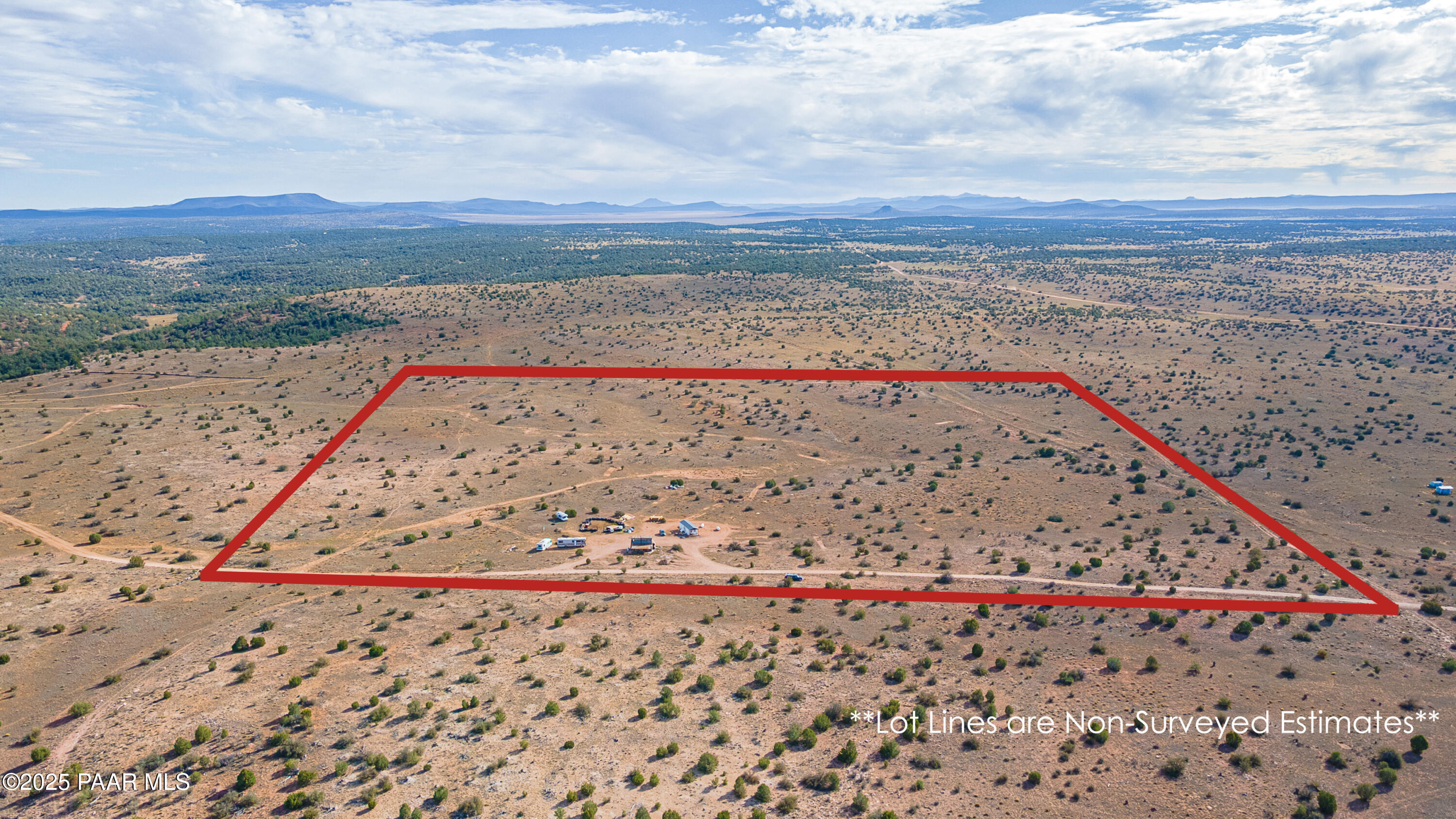 0 West Via Dolorosa Road Seligman, AZ 86337 - Photo 12 of 39 a view of a dry yard with wooden fence